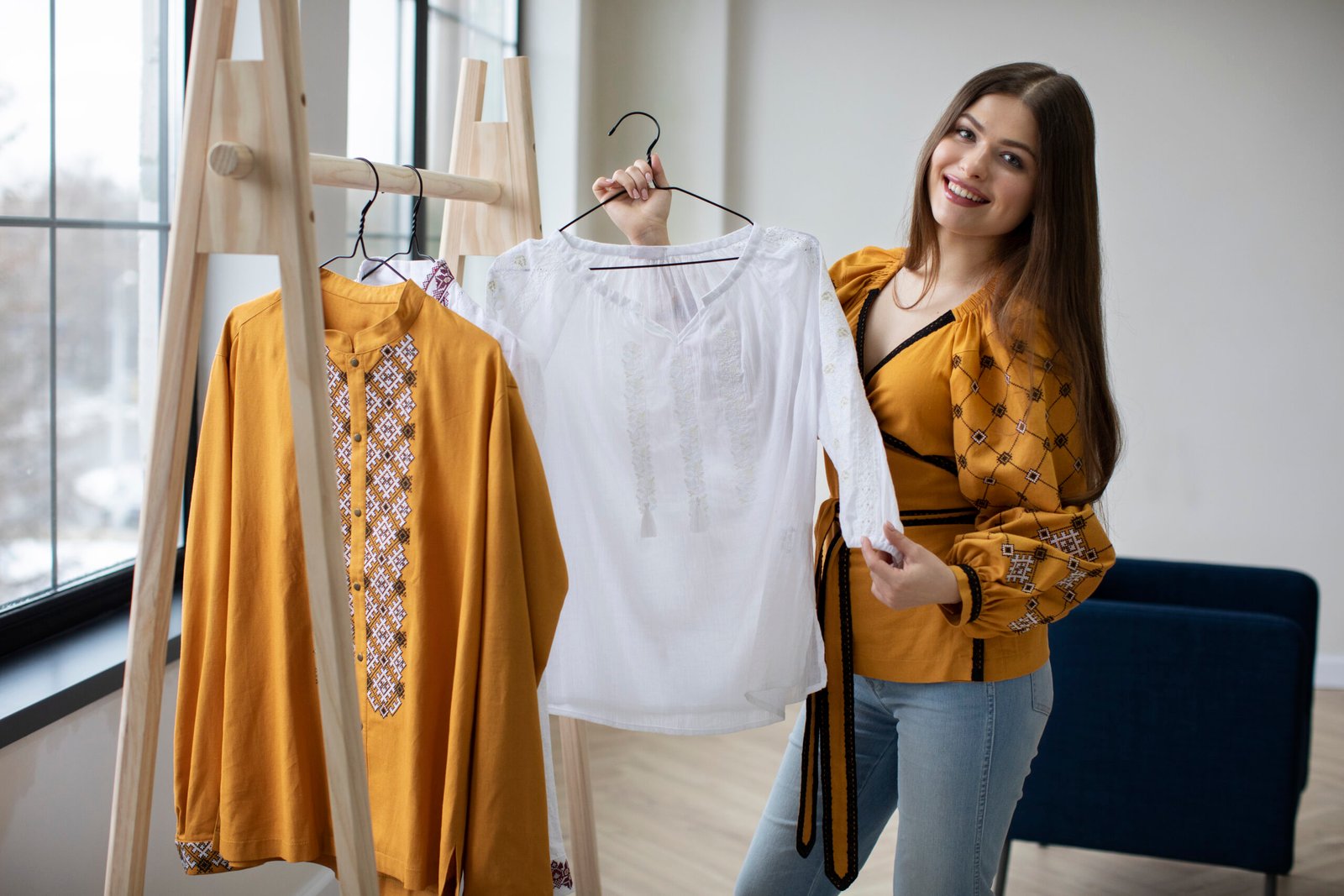 medium-shot-smiley-woman-looking-ukranian-shirt